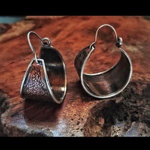 Brushed copper and silver hoops.